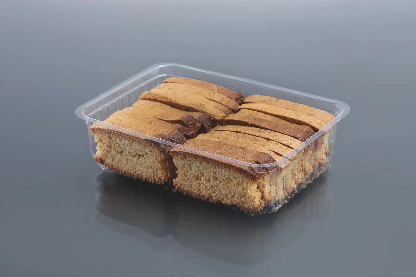 Oracle PET bakery container holding sliced cake