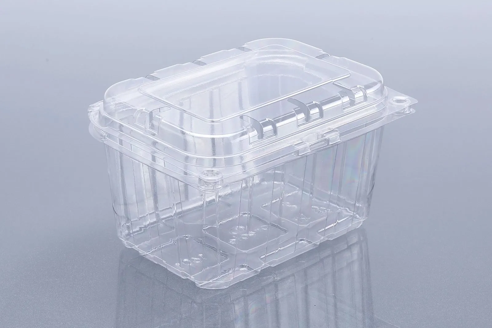 Clear Oracle PET fruit punnet with a hinged lid