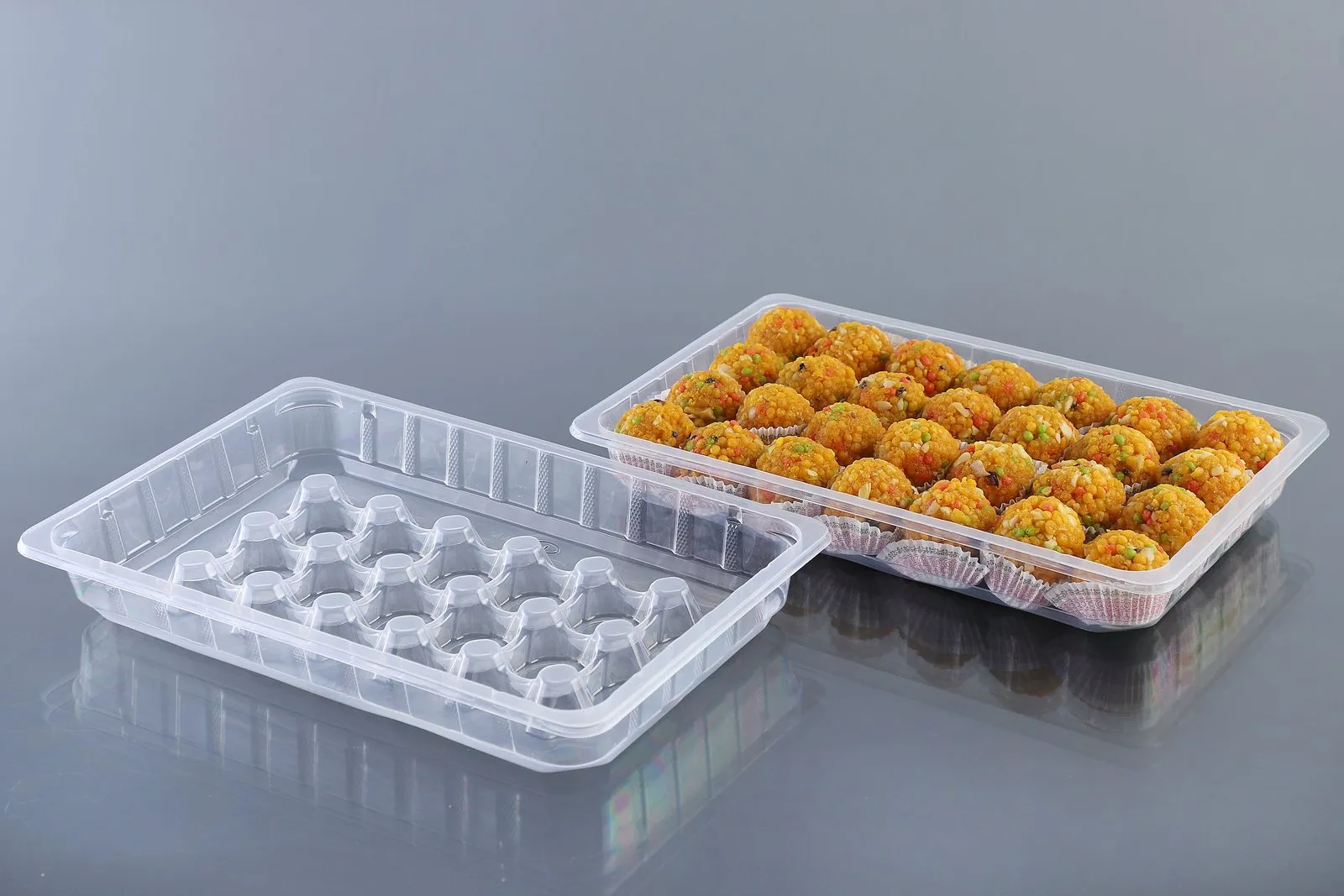 Oracle compartmental PP tray filled with laddus